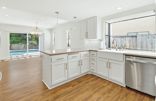 Building Photo - Stunning Upgraded 4BR Home with Pool in Desirable Rancho San Diego – Move-In Ready