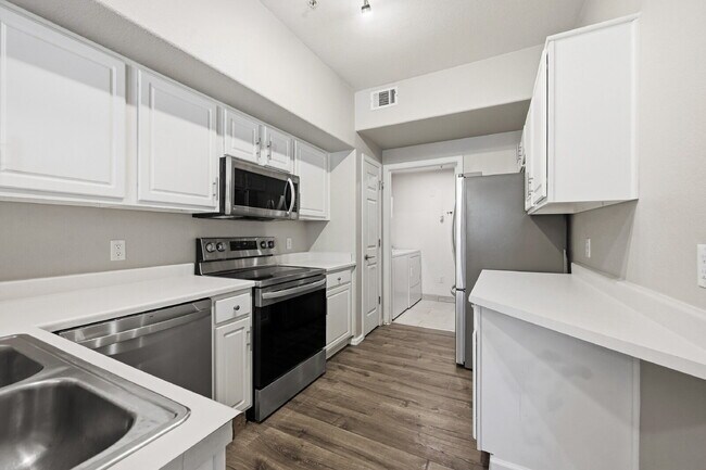 Building Photo - $1,745.95 - Ground-Level 1 Bed + Flex Room | 1.5 Bath Condo with Community Pool