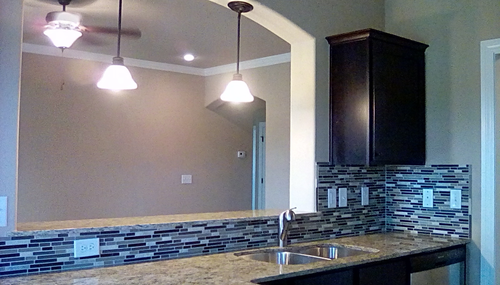 Modern kitchen with full back splash . - 4887 w croft