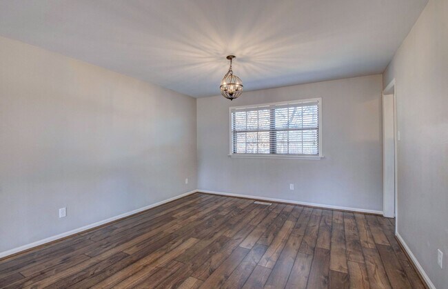 Building Photo - Welcome Home: Charming Brick Beauty with Covered Porch.