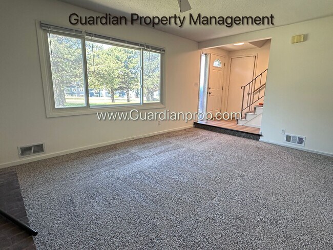 Building Photo - Renovated Burnsville Town Home, 2 Car Garage, W/D in Unit, Walk Out Patio, Dishwasher