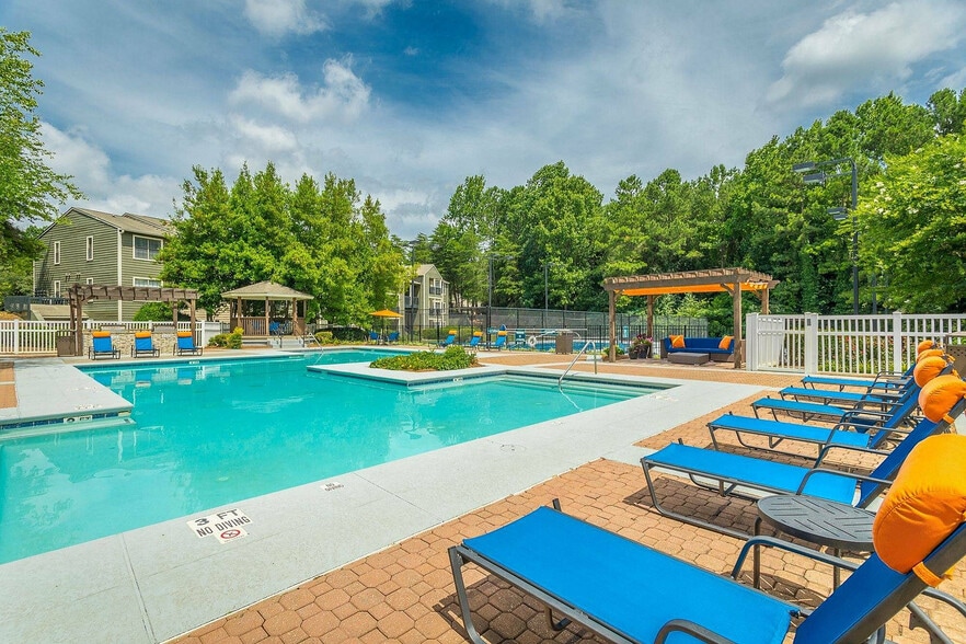 Enjoy sunny afternoons by our sparkling resort-style pool at Avenues of Kennesaw. - Avenues of Kennesaw