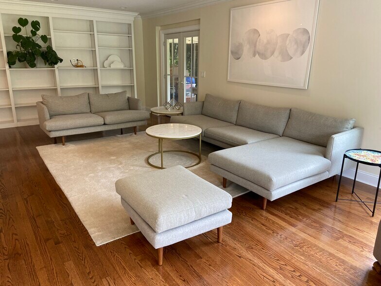 Living room with covered patio door in the back - 18 Lincoln Ave
