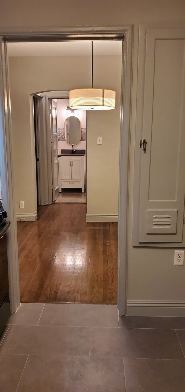 Kitchen to bathroom - 614 N Madison Ave