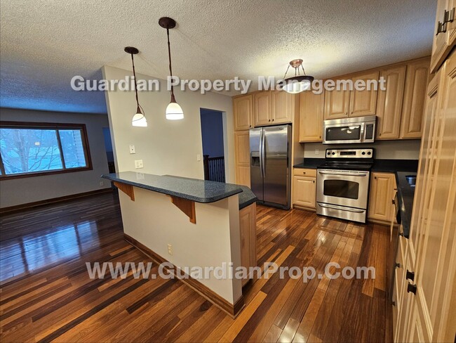 Building Photo - Updated Plymouth Single Family Home, 2 Car Garage, Large fenced Yard, Gas Fireplace