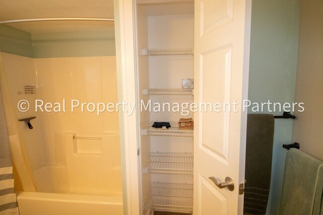 Building Photo - Spacious 3BR Townhome in Lowell | Nature Views & Maintenance-Free Living