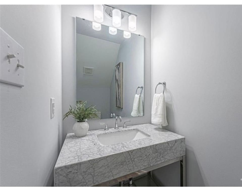 Marble and chrome vanity in powder room - 1017 Hightower St