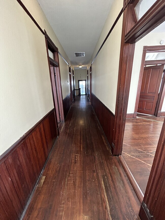 Center hall with bedrooms & kitchen on one side and dining, living and bath on the other. - 1118 25th St