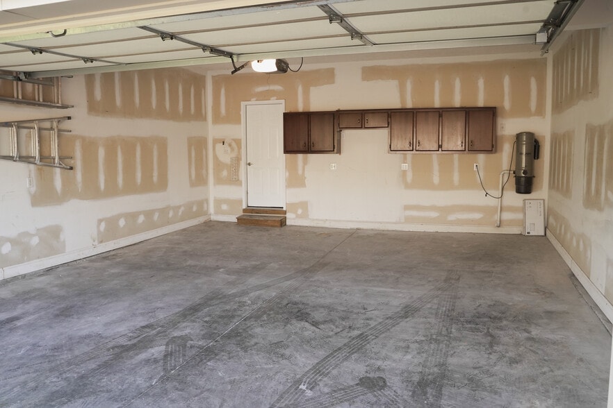 Two Car Extended Garage (22x25) with storage cabinets and central vacuum. - 393 Hays Blvd