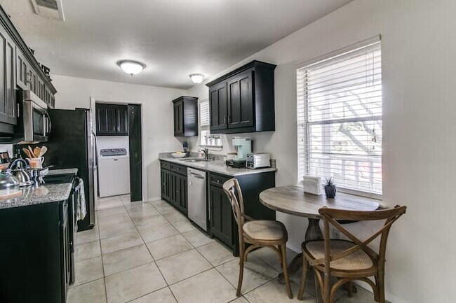 Washer and dryer outside of kitchen - 501 Rogers Way