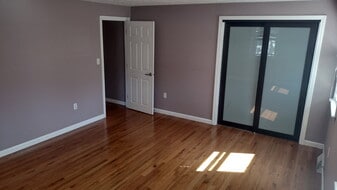 hardwood and glass doors in main bedroom - 82 Union St