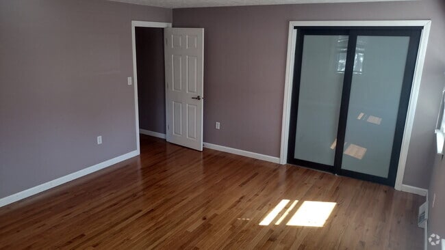 hardwood and glass doors in main bedroom - 82 Union St