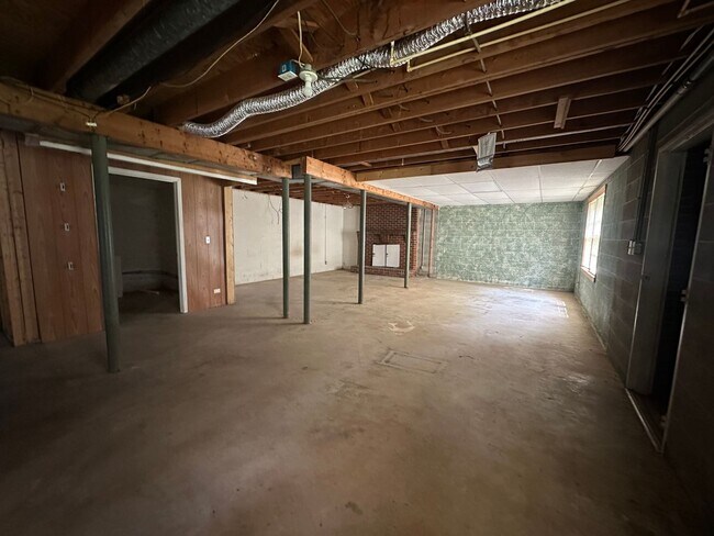 Building Photo - Spacious brick house with a caport and unf...