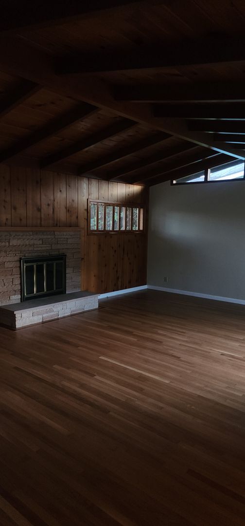 Building Photo - This is a spacious house featuring four bedrooms and two bathrooms, along with a two-car garage.