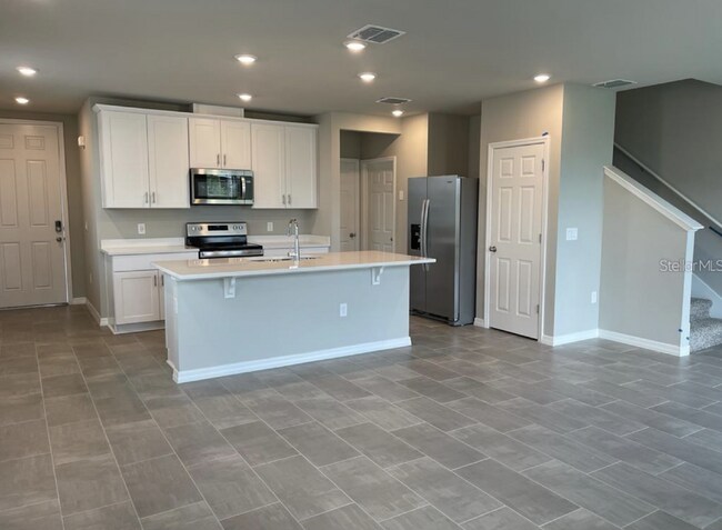 Building Photo - Beautiful corner unit townhouse features an abundance of natural light.