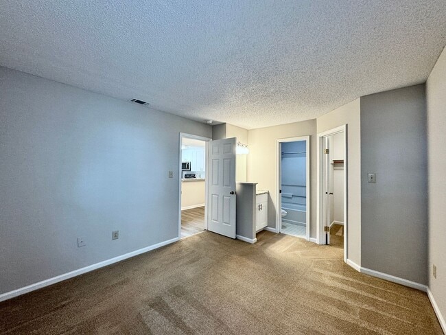 Building Photo - Updated 1st Floor/1-Level Condo Available NOW & Rent Includes Water, Sewer, Trash, Landscaping, F...