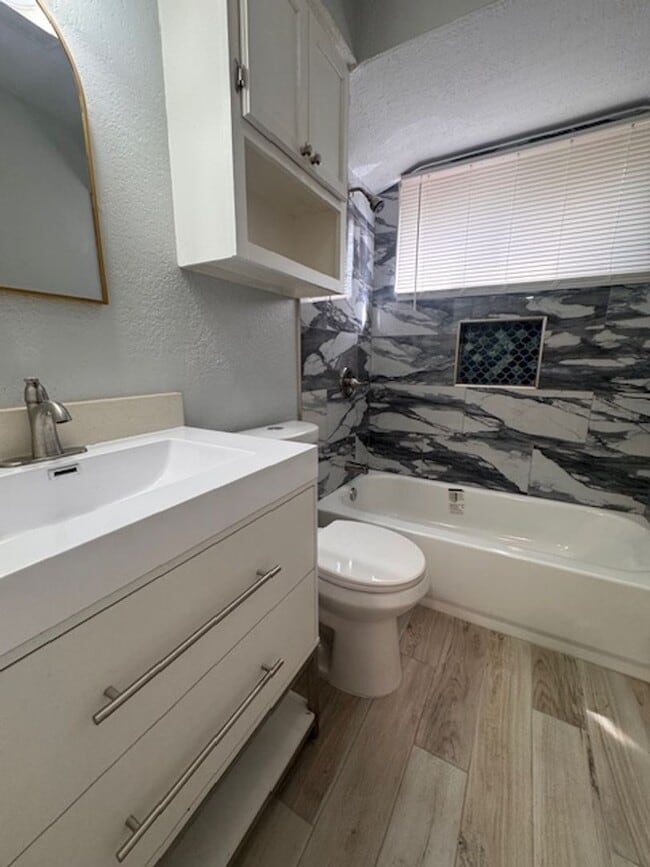 Building Photo - $300 off your move in by June 1st!   Newly remodeled 3 bed 1 bath garage conversion with monitore...