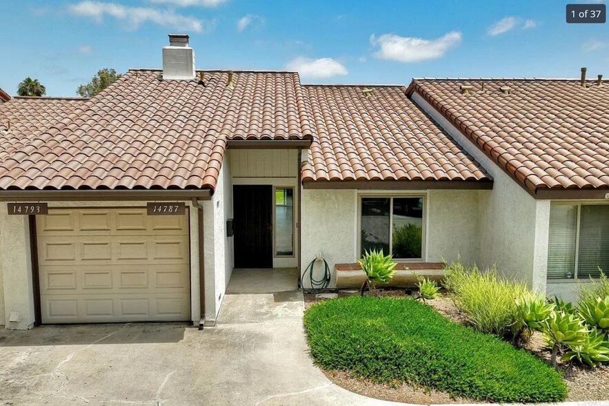 Front of unit, with private entry and attached garage. Landscaping included. - 14787 Caminito Orense Oeste