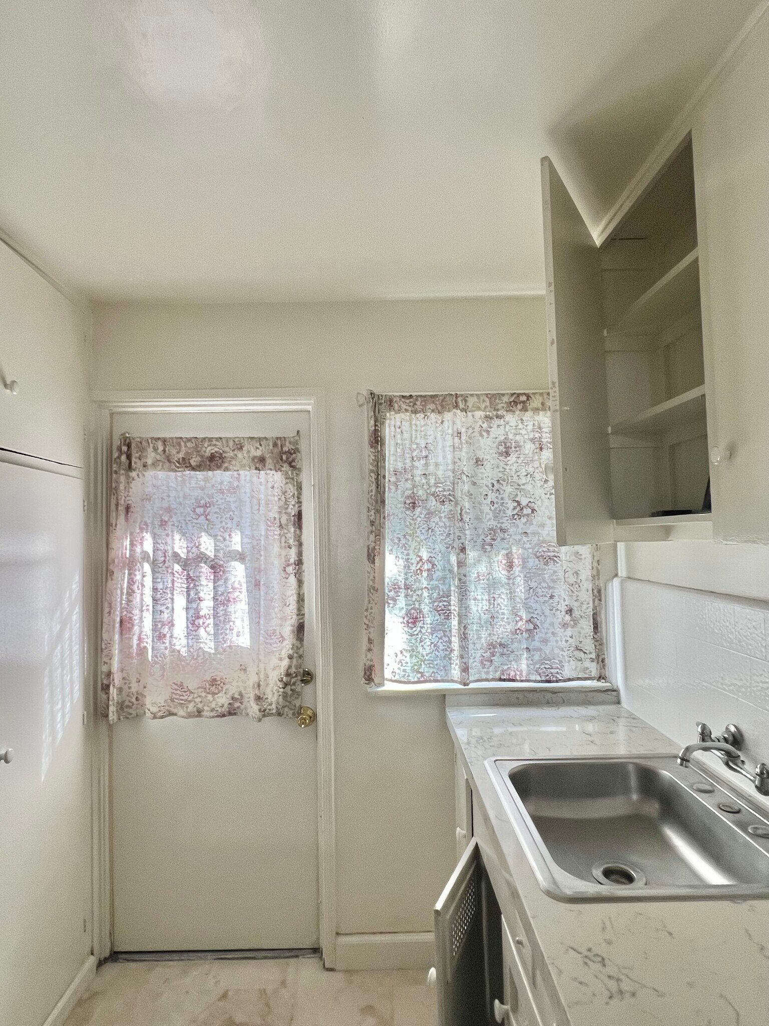 kitchen space newly renovated. more photos to come. stove/oven included, all new flooring/countertop - 715 N Jackson St