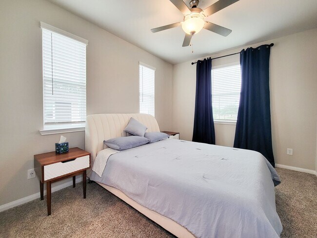 Building Photo - A true gem on a quiet corner lot, this spacious and sun-filled home is tucked away from street no...