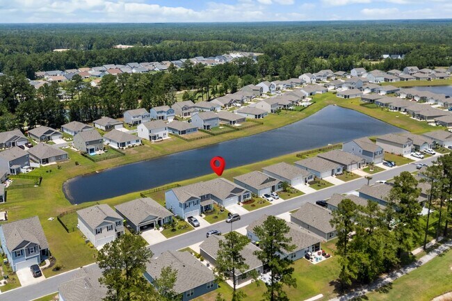 Building Photo - Modern 4BR Home with Screened Porch & Pond Views | Sun Colony, Longs SC
