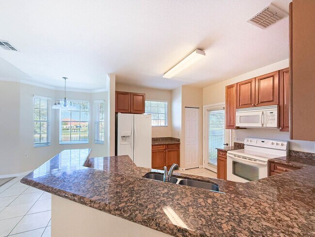 Building Photo - Beautiful 3-Bedroom Condo with 2-Car Garag...