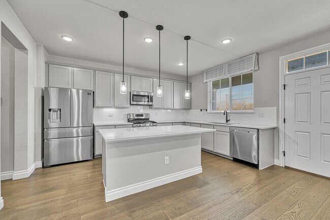 Building Photo - Former Model Home - Superb townhome in great location!