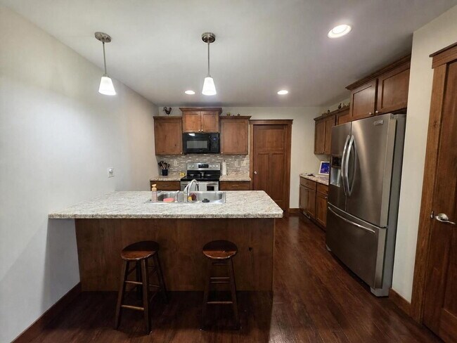 Building Photo - FREE SEPTEMBER RENT for this Spacious 4-Bedroom Home with Vaulted Ceilings with Finished Basement...