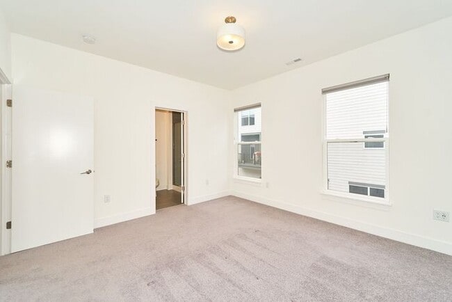 Building Photo - Like New Townhome With Your Own Rooftop Views of Downtown Indy!