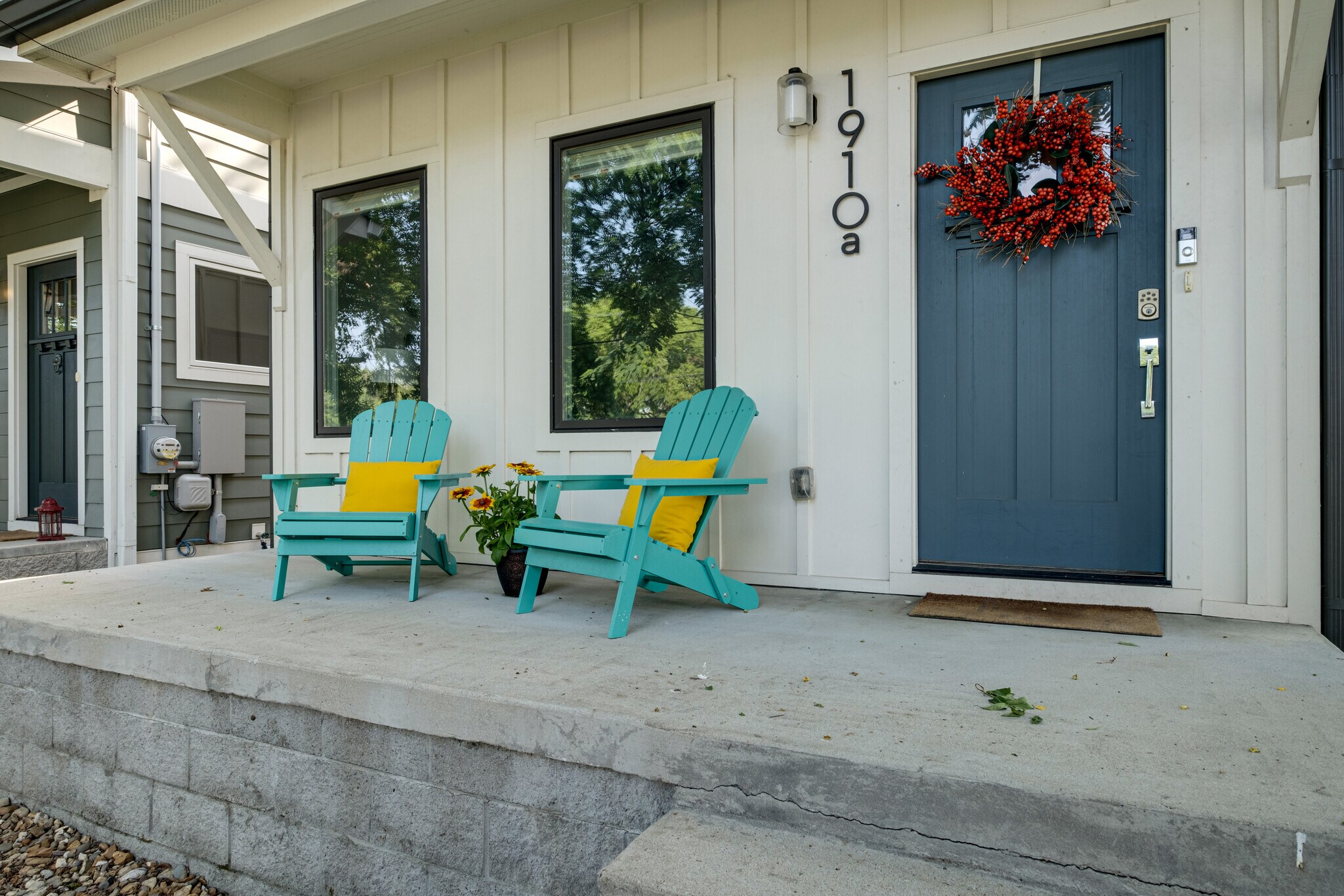 Adirondack seating in front of house. - 1910 11th Ave N