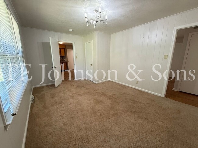 Building Photo - 3BR Home with Stainless Steel Appliances, Hardwood Floors & Carport