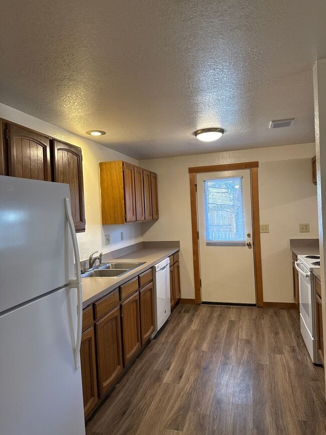 Building Photo - RV Parking, SMALL DOG OK, NE 3 Bdrm, 2 Bath House, All Appliances, Wood Stove, Dbl. Garage