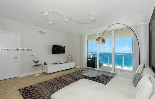 Building Photo - 16699 Collins Ave