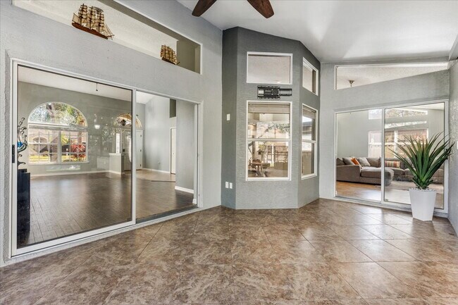 Building Photo - A vibrant 2-bedroom, 2-bathroom tropical retreat designed for both high-energy entertaining and l...
