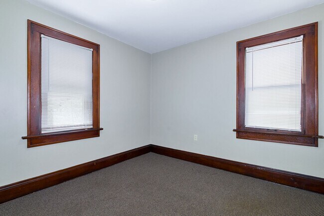 Building Photo - Charming 3BR Home with Classic Woodwork, Porch & Bonus Attic Space