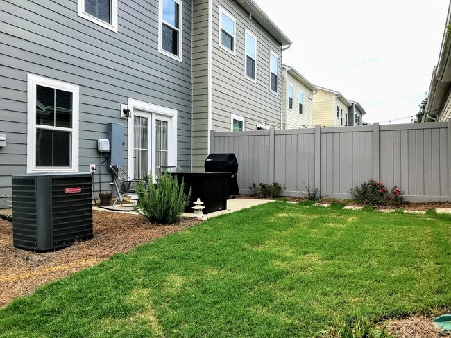 Grass outdoor area with patio and detached 2-car garage - 11275 Bryton Pkwy