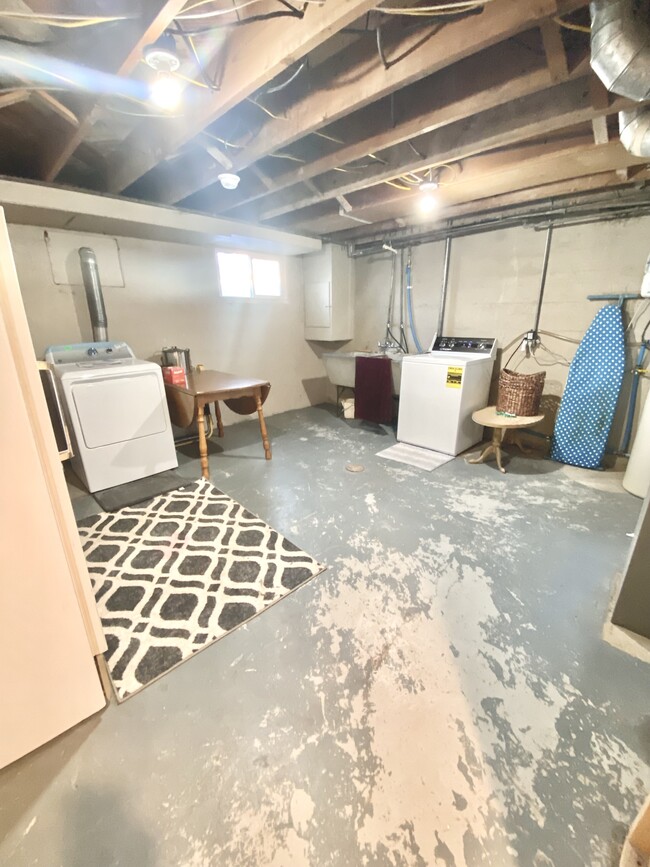 Included washer and dryer with spacious laundry room. - 141 N 1st E