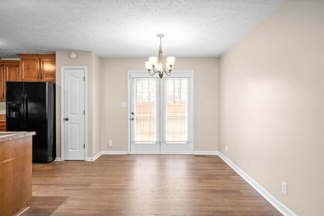 Building Photo - Pet Friendly Three Bedroom with Bonus!