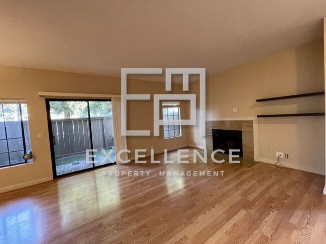 Building Photo - 2/2 Condo with 1 Car Garage, Wrap Around Patio, Fireplace, Granite Kitchen and Community Pool