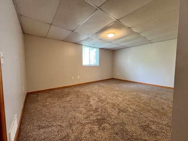 Building Photo - Spacious 3BR Duplex with Finished Basement & 2-Car Garage in Otsego