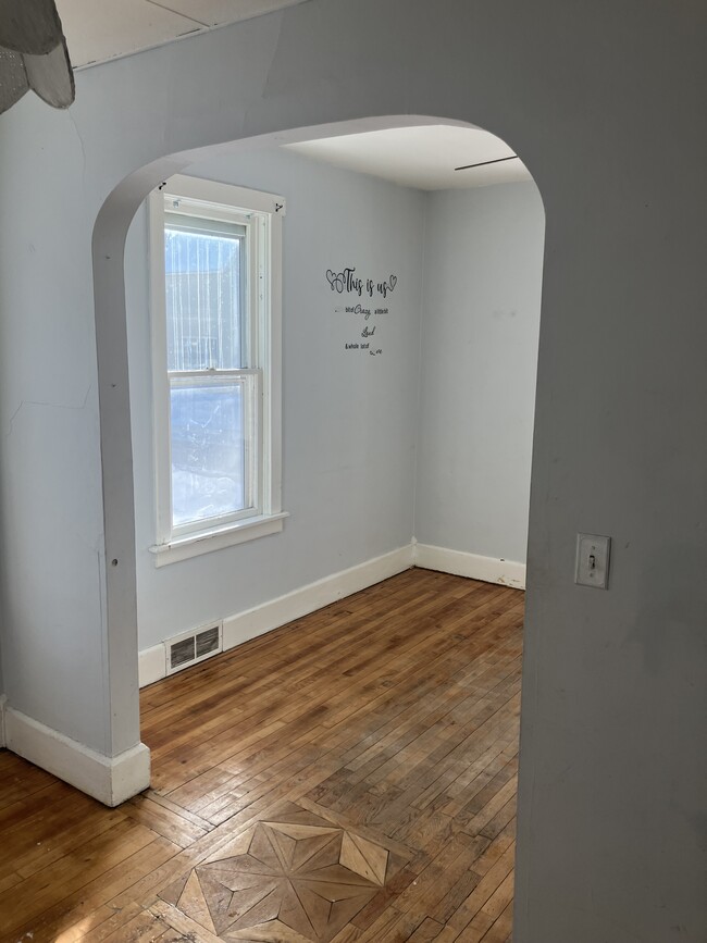 Dining room into living room - 511 E Empire St