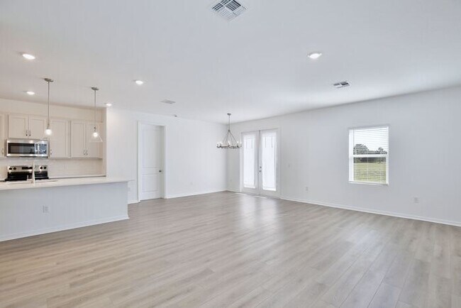 Building Photo - Stylish Sunbrooke Sanctuary! Modern 4/2 Home with High Ceilings, Designer Kitchen & Resort Amenities