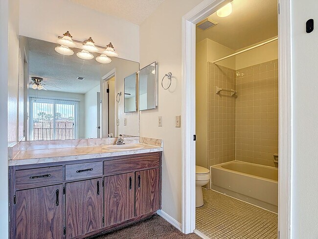 Building Photo - Spanish-Style 3 Bedroom, 2.5 Bath Mediterranean Rooftop Townhouse – Basic Cable & Wi-Fi Included!