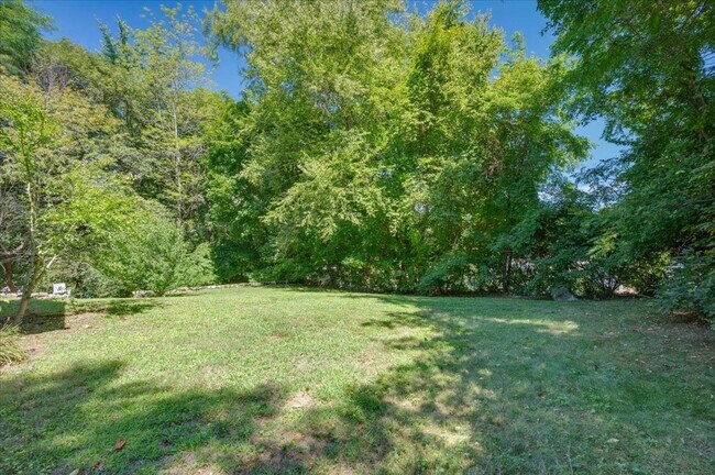 Building Photo - Elegant Multi-Level Brick Residence with Outdoor Oasis