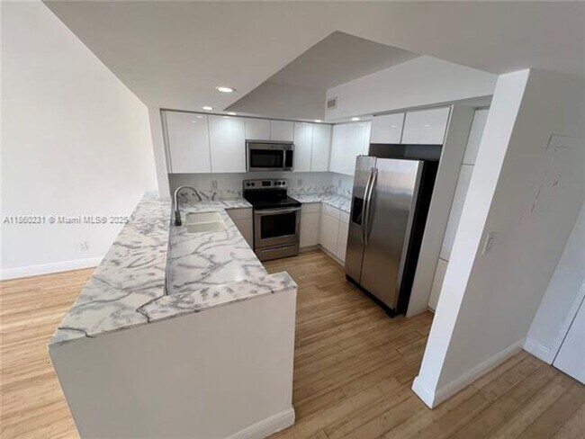Building Photo - 5600 Collins Ave