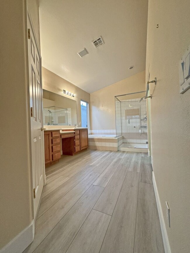Building Photo - Vaulted Ceiling single-story home in a gat...