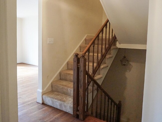 Building Photo - Beautiful brick townhome featuring three f...