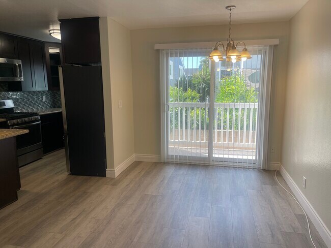 Vinyl slider that opens to a private balcony. - 2411 Prospect Ave
