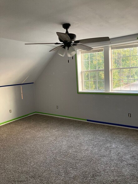 Upstairs Bedroom (2) -- still needs painted (painters tape shown) - 910 E High St