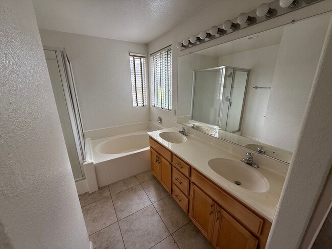 Building Photo - Gated 3BR|2.5BA|1508SF|2 Car Garage| Tenant pays $175 for WS&G | Community Pool, Clubhouse, & Fis...